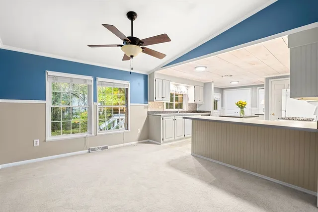a view of a kitchen with a sink and a window