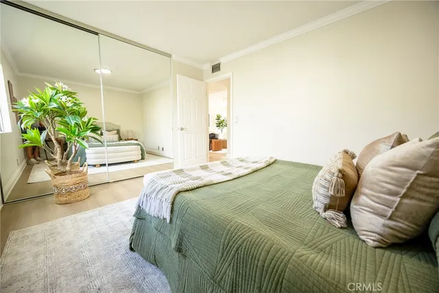 a bedroom with a bed and a couch