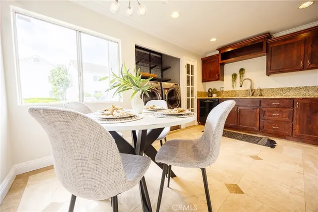 a dining room with furniture and window