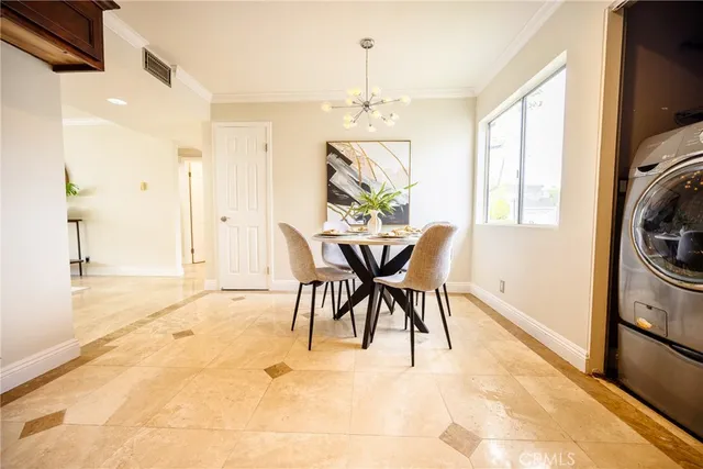 a view of a dining room with furniture window and outside view