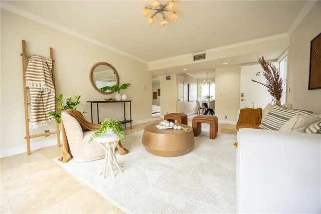 a living room with furniture a window and flowerpot