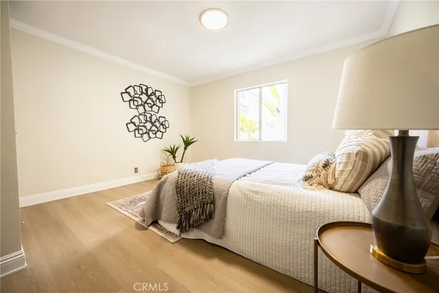 a bedroom with a bed and a couch