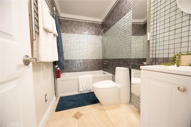 a bathroom with a toilet a sink and a bathtub