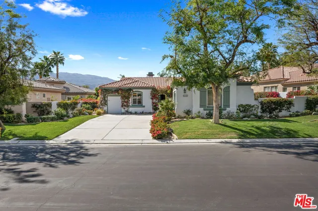 a flower plants in front of a house