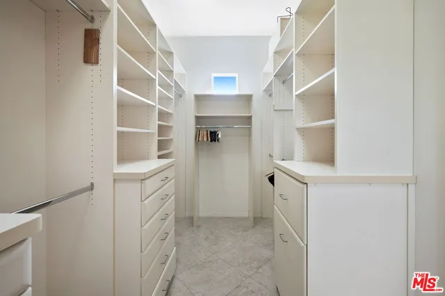 a large bathroom with a large tub and sink