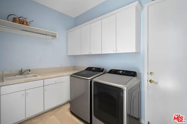 a bathroom with a granite countertop sink a toilet a mirror and shower