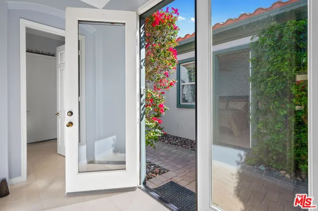 a room with a sink and a mirror