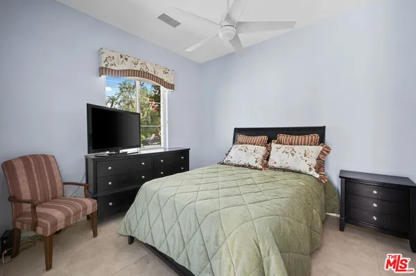 a view of a patio with table and chairs potted plants with wooden floor