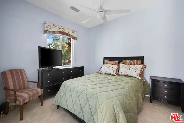 a view of a patio with table and chairs potted plants with wooden floor