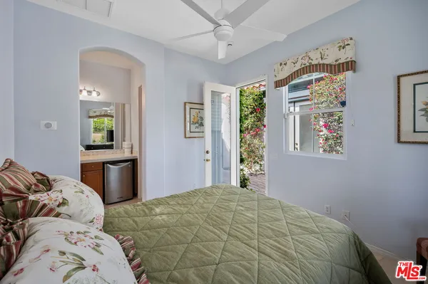 a view of a swimming pool with a patio and a yard