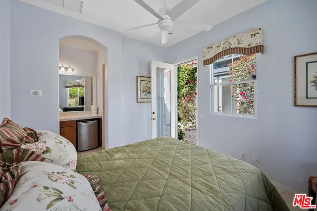 a view of a swimming pool with a patio and a yard