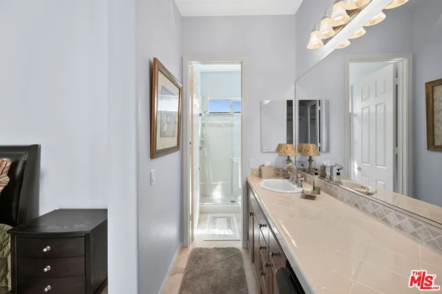 a view of a backyard with plants and a patio