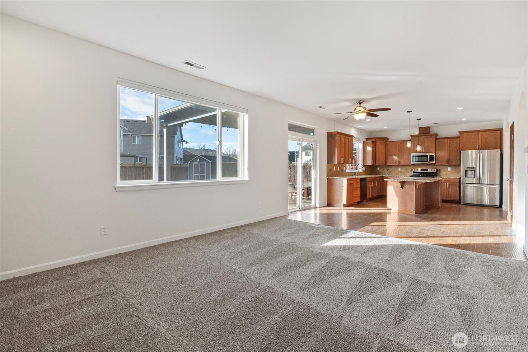 204 Balmer Street Southwest Orting, WA 98360 - Photo 12 of 29 a view of a kitchen with stainless steel appliances cabinets