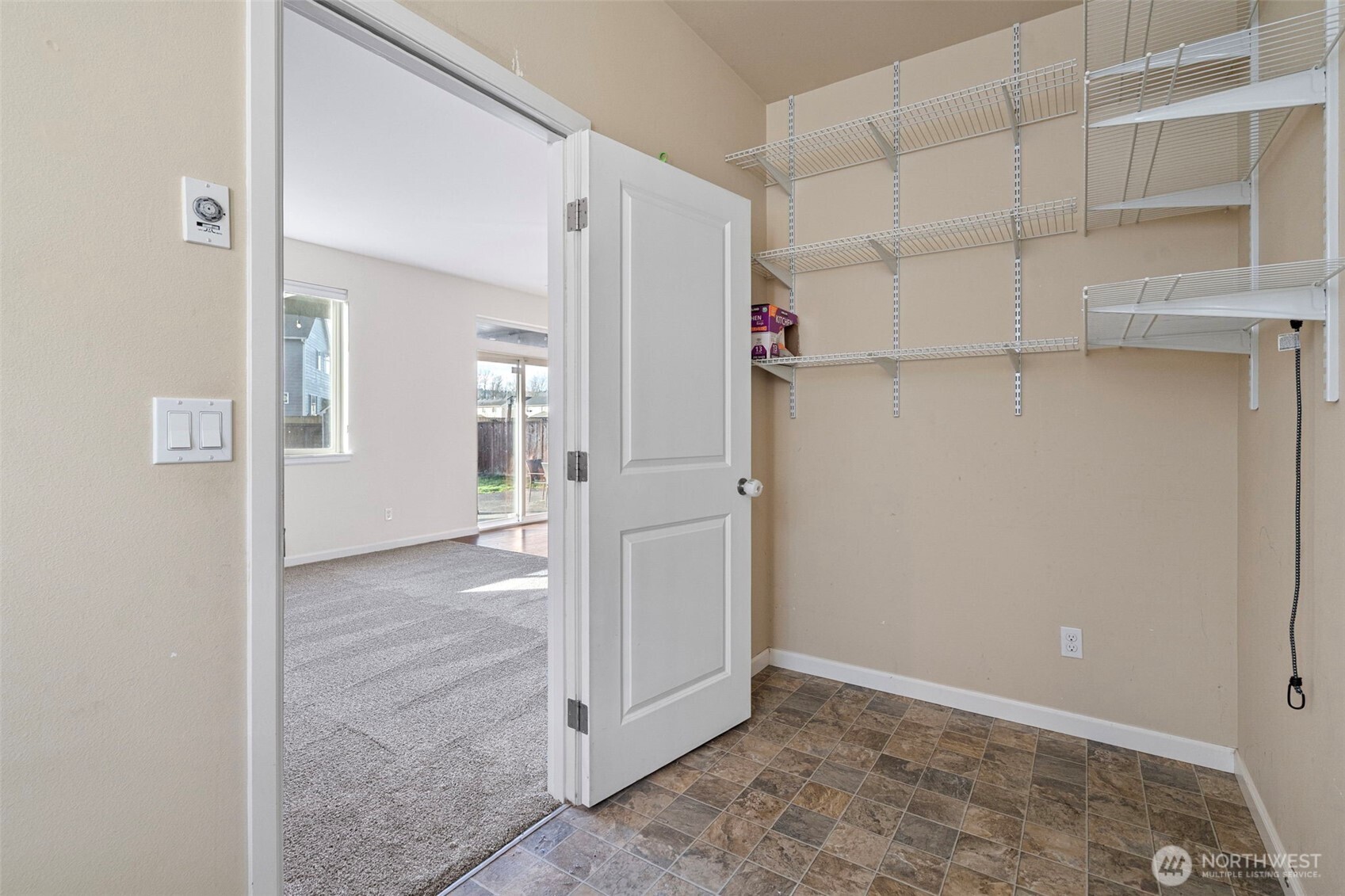 204 Balmer Street Southwest Orting, WA 98360 - Photo 13 of 29 an empty room with cabinet and mirrors