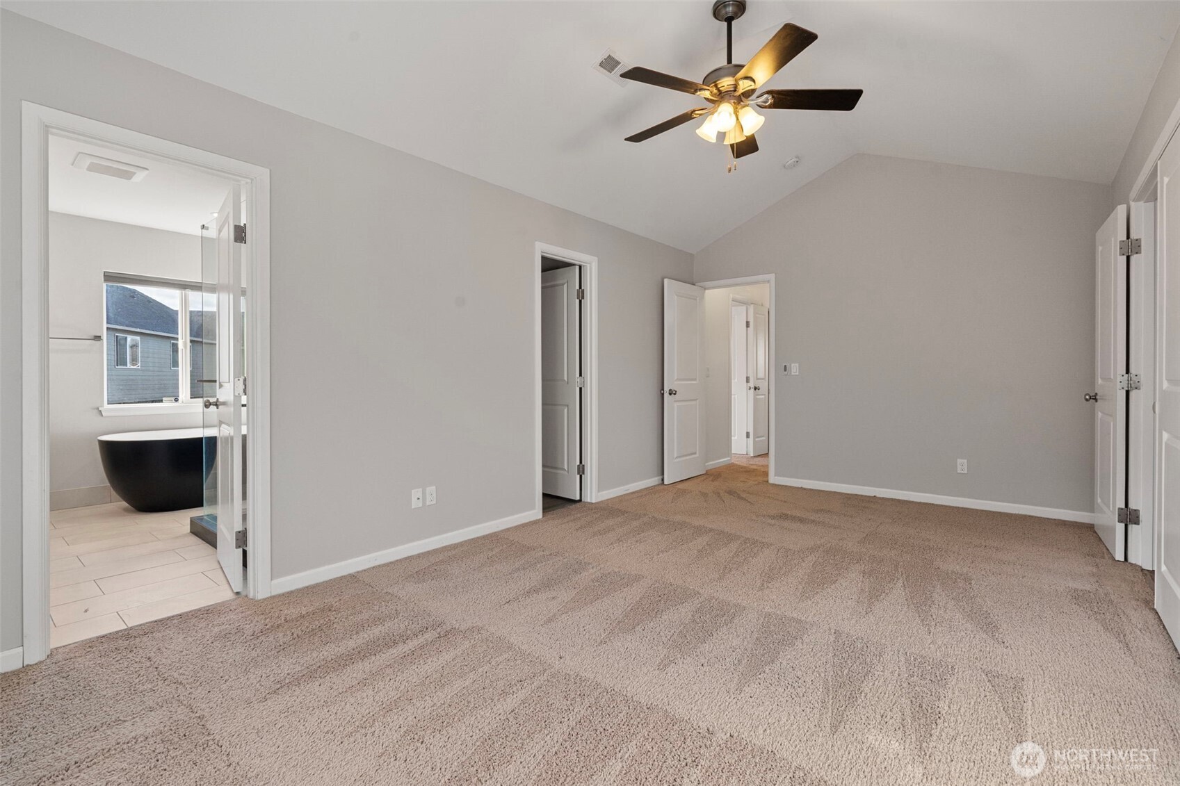 204 Balmer Street Southwest Orting, WA 98360 - Photo 18 of 29 a view of a big room with chandelier fan and windows