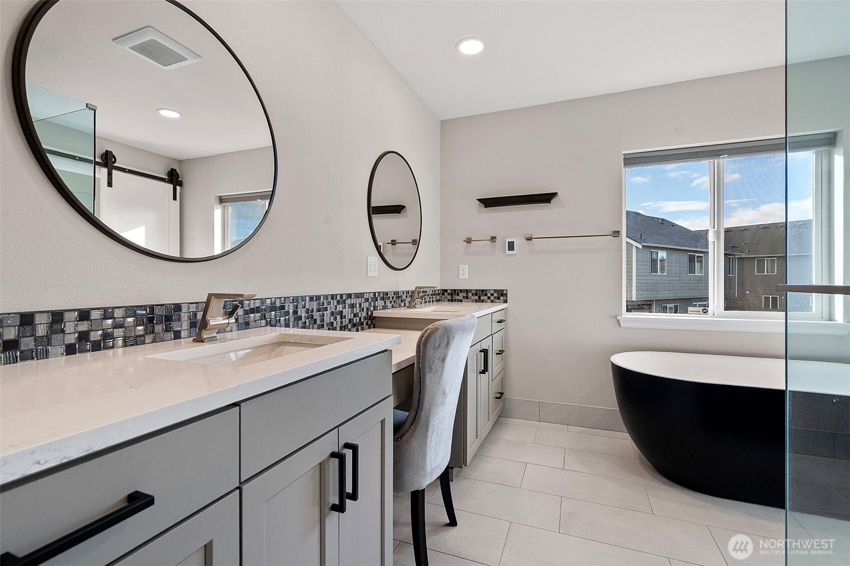 204 Balmer Street Southwest Orting, WA 98360 - Photo 19 of 29 a bathroom with a double vanity sink and a mirror