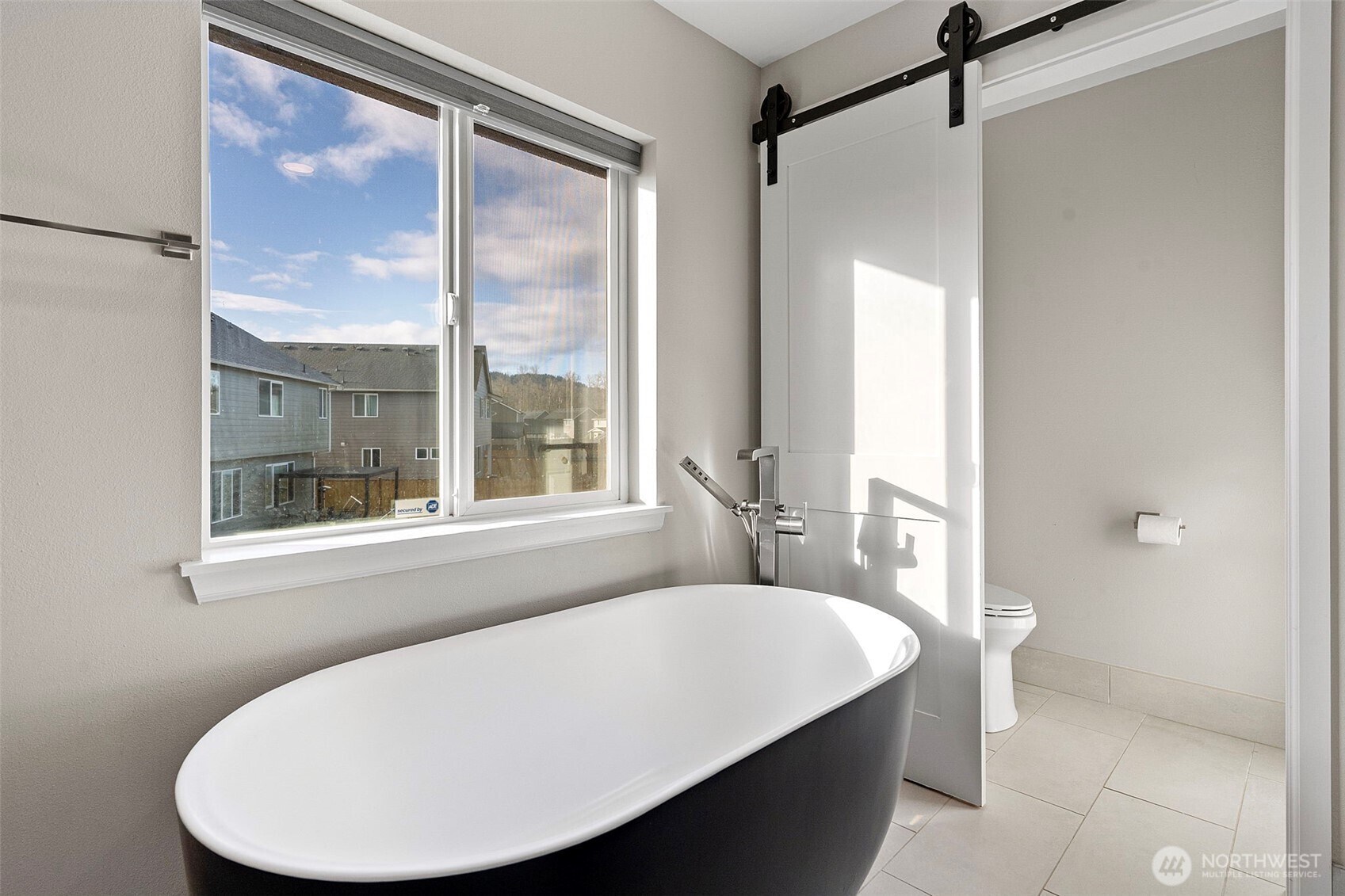 204 Balmer Street Southwest Orting, WA 98360 - Photo 20 of 29 a bathroom with a tub and a shower