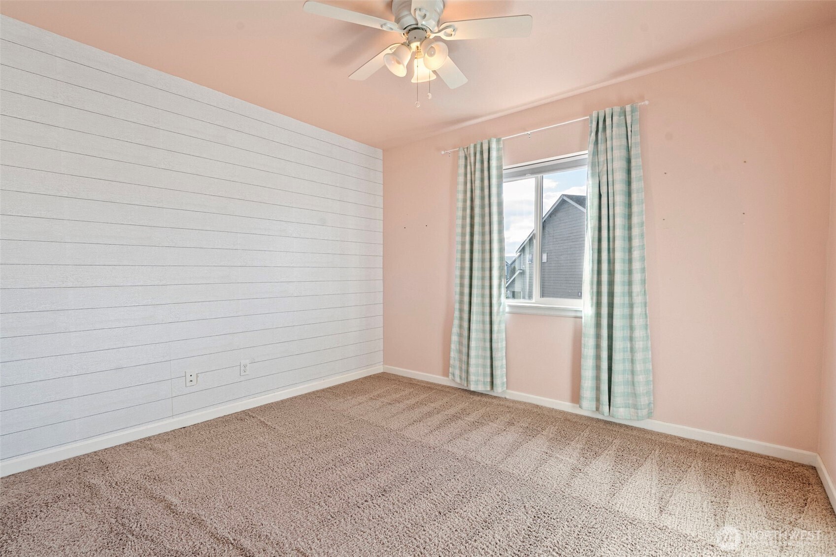 204 Balmer Street Southwest Orting, WA 98360 - Photo 22 of 29 a view of an empty room with a window