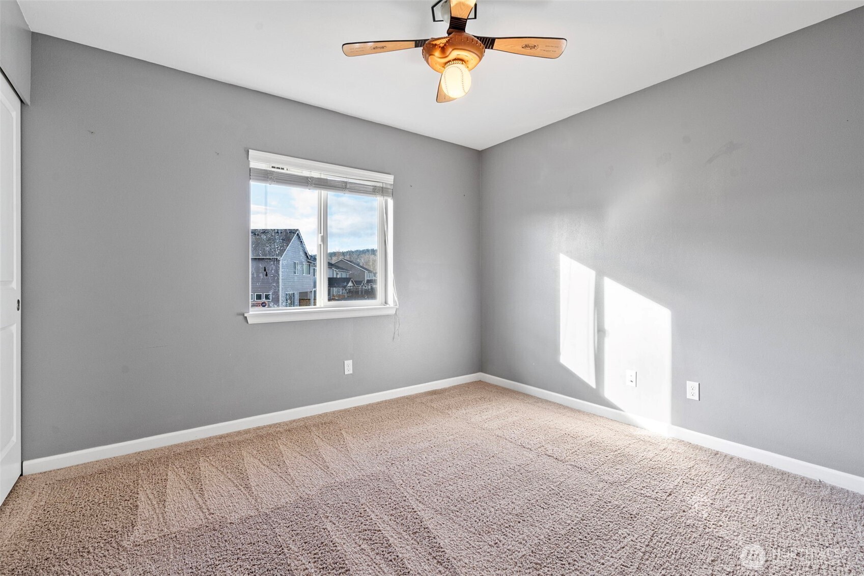 204 Balmer Street Southwest Orting, WA 98360 - Photo 23 of 29 a view of an empty room with a window