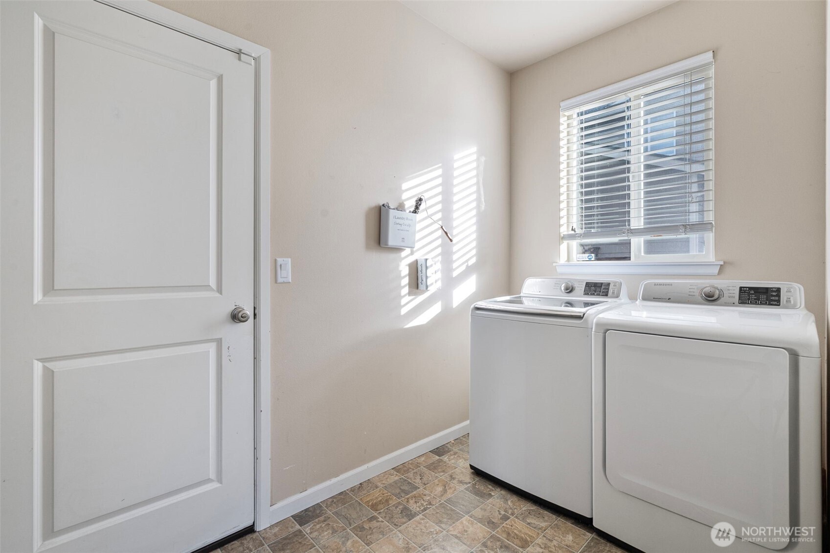 204 Balmer Street Southwest Orting, WA 98360 - Photo 26 of 29 a bathroom with a sink a vanity and a mirror