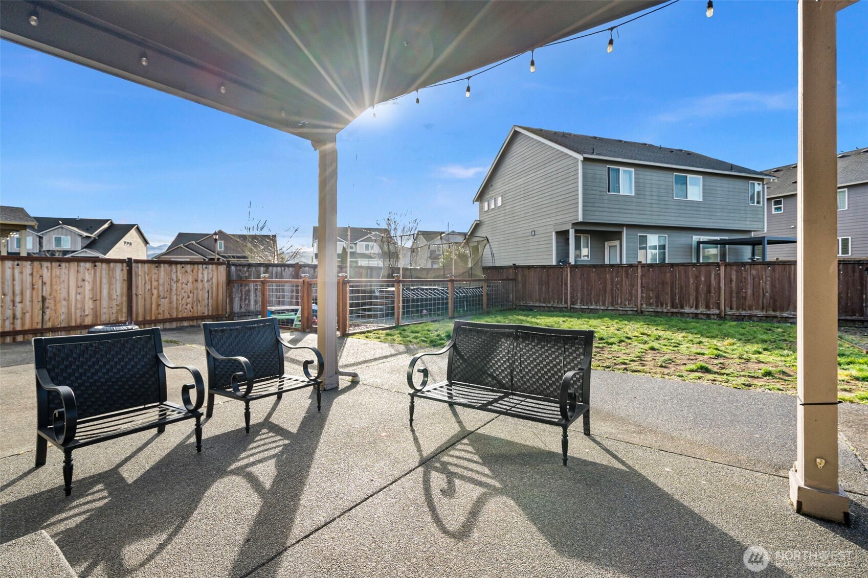 204 Balmer Street Southwest Orting, WA 98360 - Photo 27 of 29 a view of a terrace with furniture and a yard
