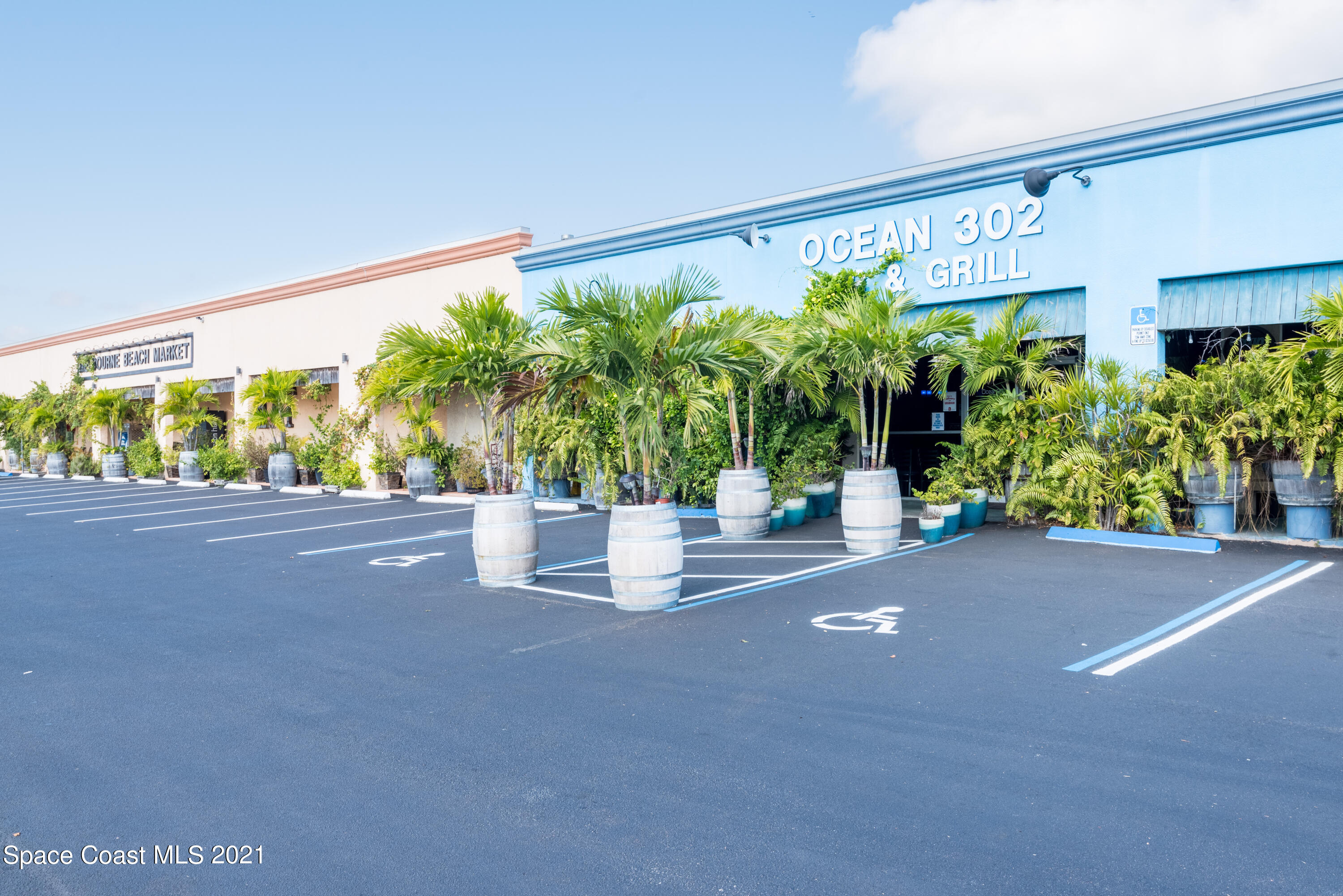 180 Richards Road Melbourne Beach, FL 32951 - Photo 40 of 49 a potted plant sitting in front of a building