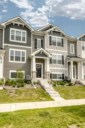 a front view of a building with a swimming pool