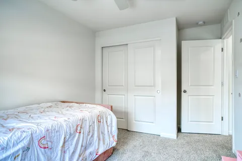 a bedroom with a bed and a bathroom