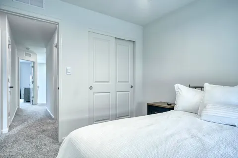 a bedroom with a bed and closet