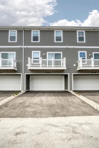 a front view of building with yard