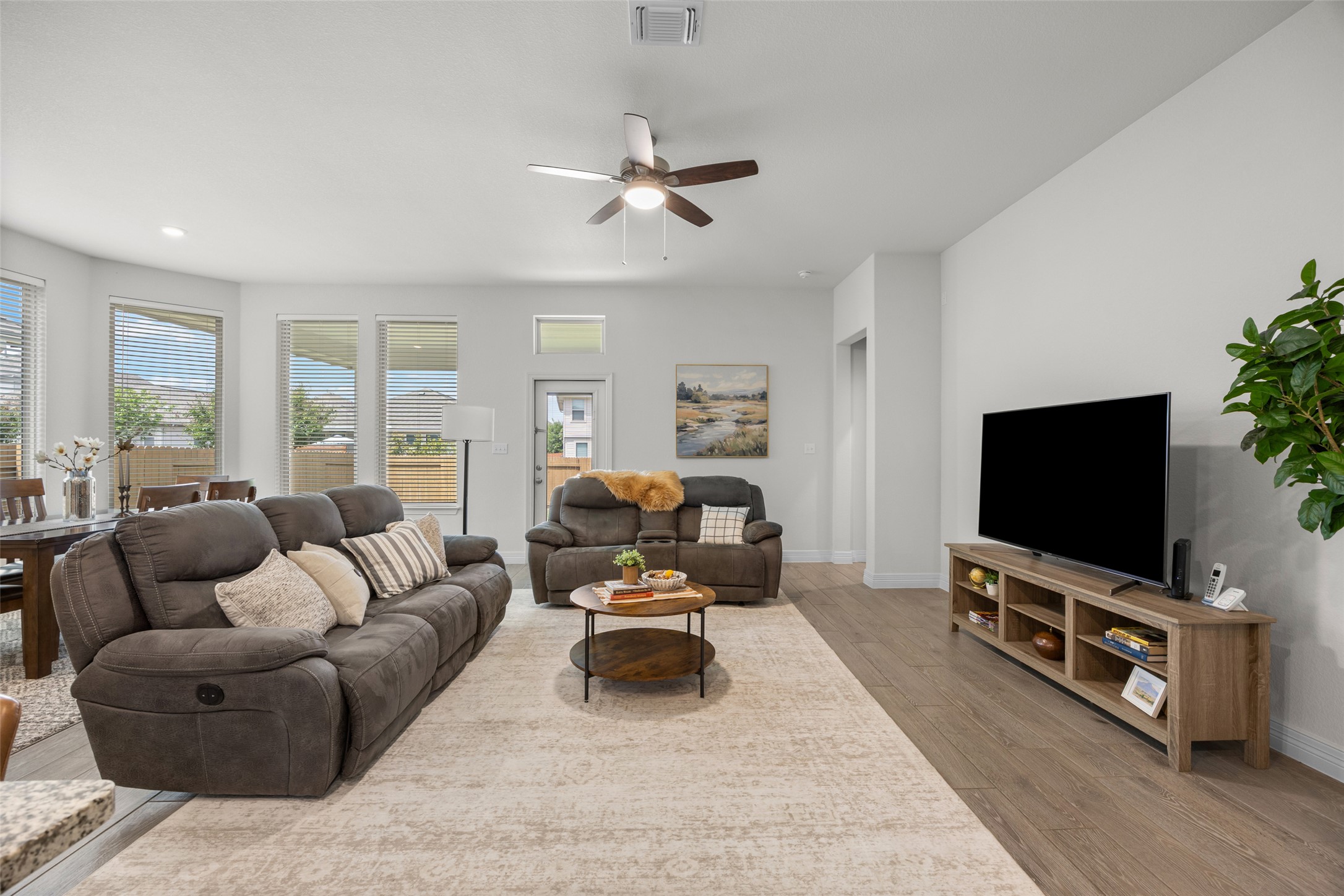 704 Muster Bend Georgetown, TX 78626 - Photo 15 of 39 Living area with ceiling fan, light wood finished floors, and recessed lighting