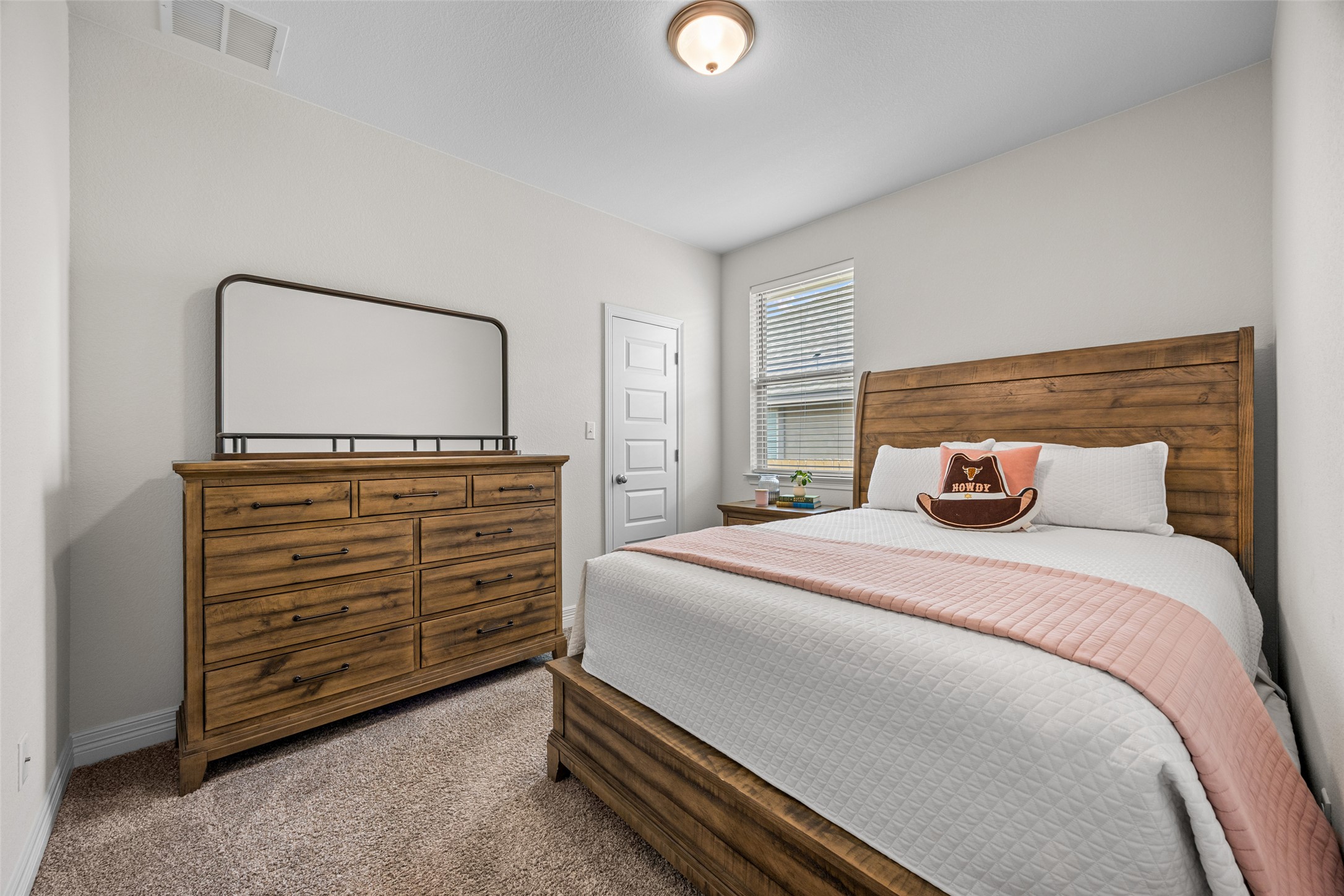 704 Muster Bend Georgetown, TX 78626 - Photo 28 of 39 Bedroom with dark carpet and baseboards