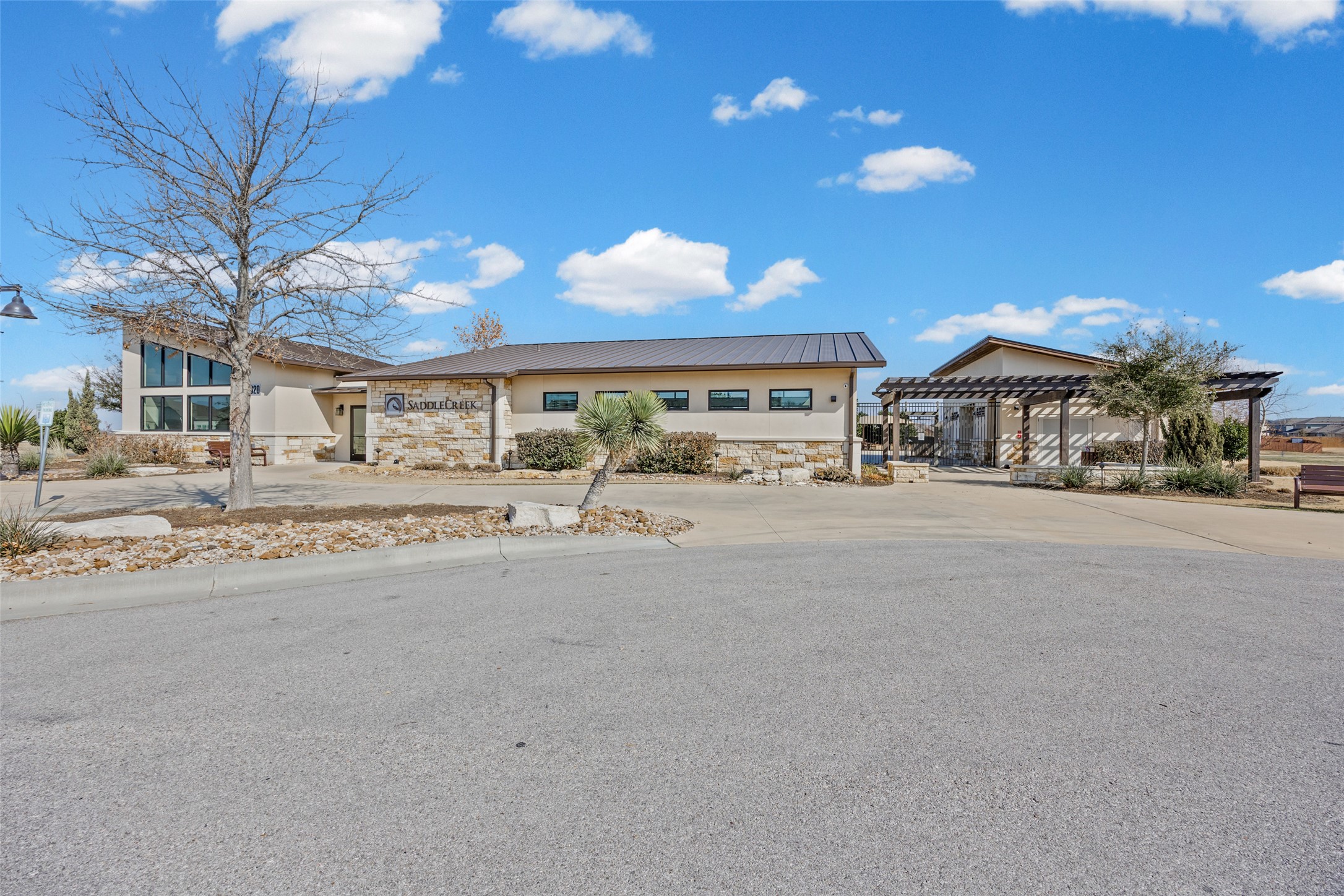 704 Muster Bend Georgetown, TX 78626 - Photo 29 of 38 View of front of property featuring stone siding, stucco siding, and concrete driveway