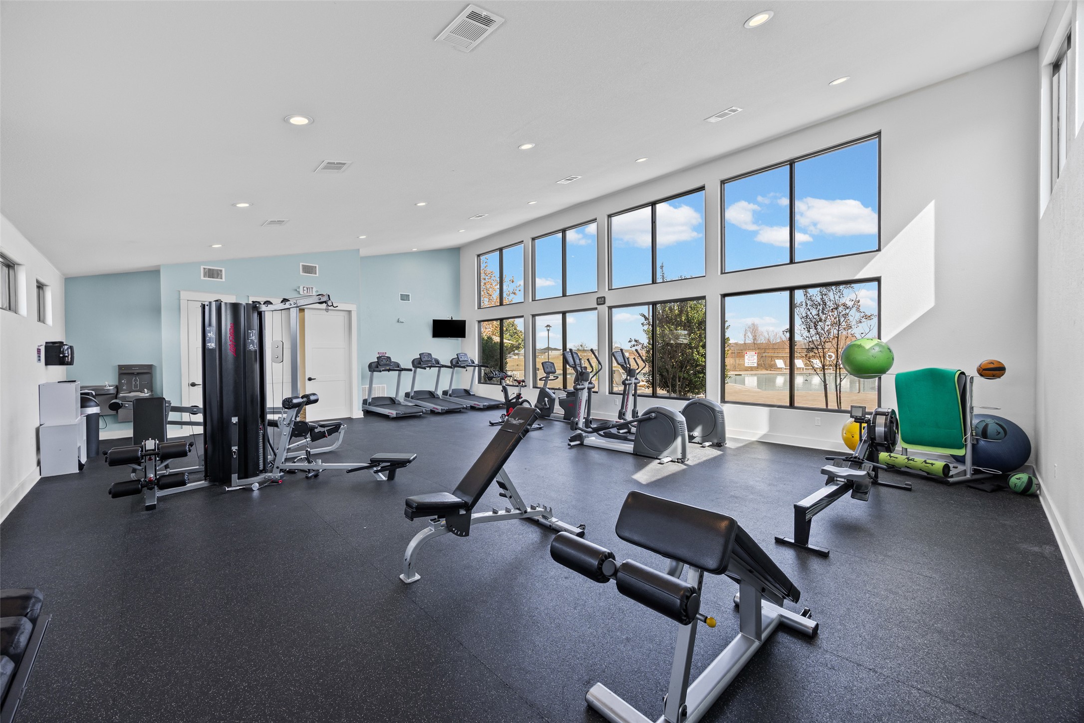 704 Muster Bend Georgetown, TX 78626 - Photo 30 of 38 Workout area featuring a high ceiling and recessed lighting