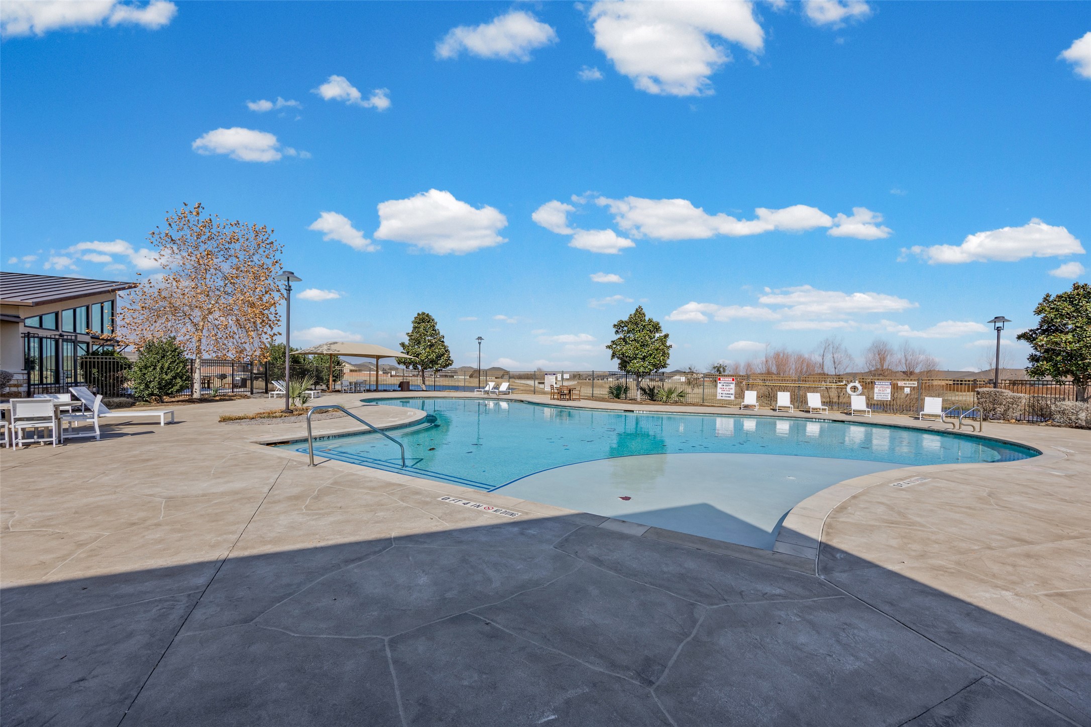 704 Muster Bend Georgetown, TX 78626 - Photo 32 of 38 Community pool featuring a patio