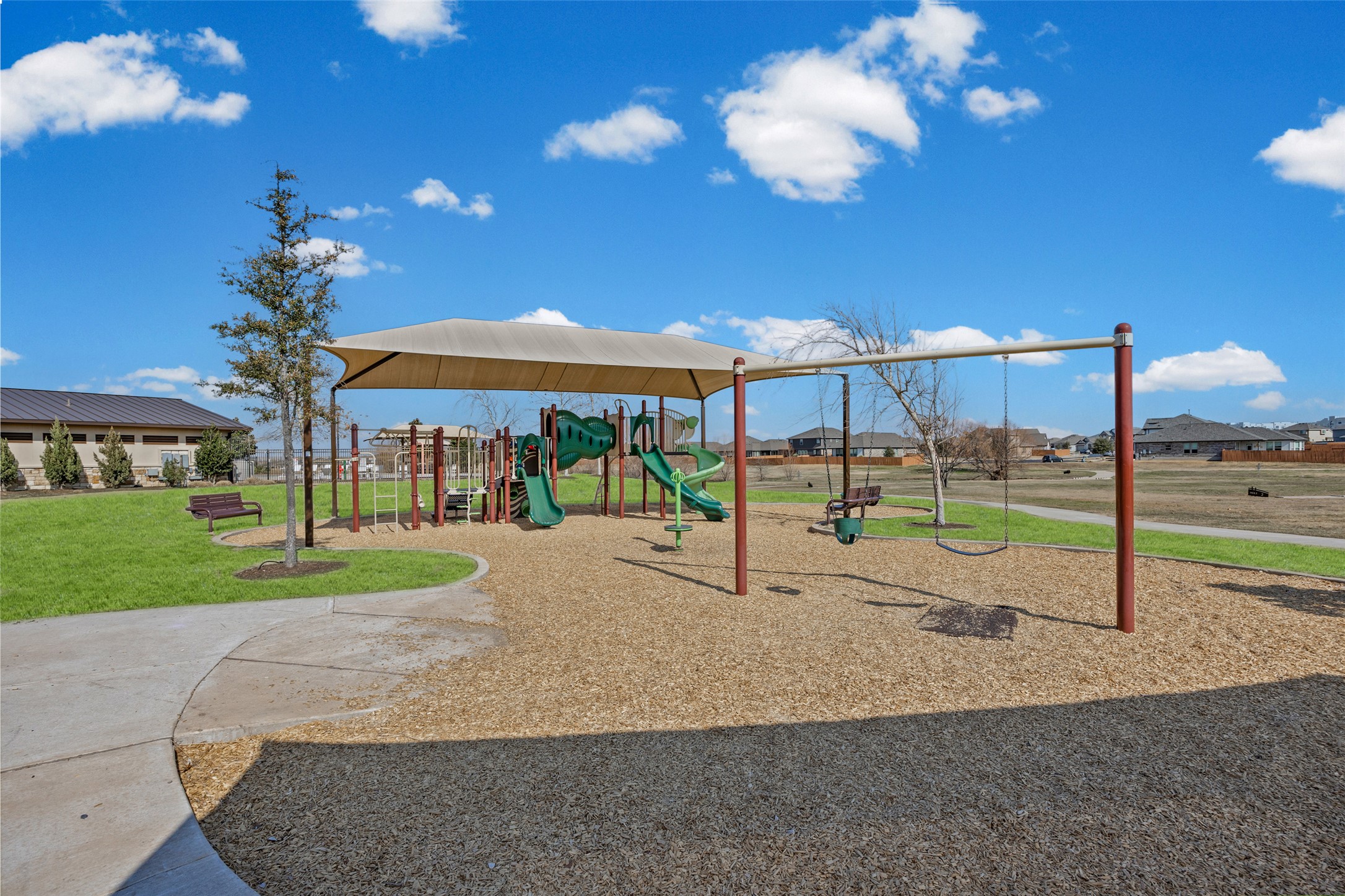 704 Muster Bend Georgetown, TX 78626 - Photo 33 of 38 Community play area with a yard