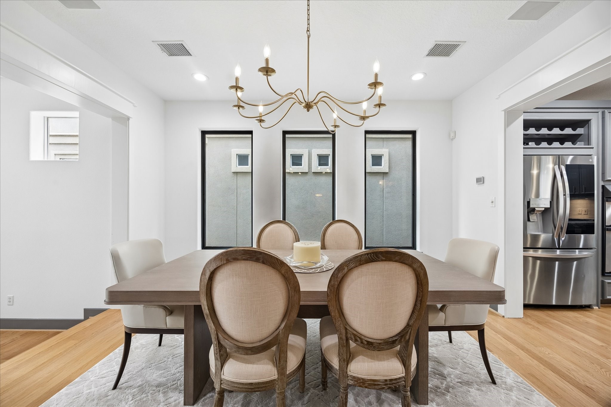 6406 Rodrigo Street, Unit B Houston, TX 77007 - Photo 9 of 27 Formal dining room with recessed lighting, chandelier, and wood flooring. Dining room is situated between the living room and the kitchen for ease of entertaining.