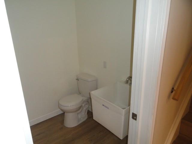 1248 East Brady Street Butler, PA 16001 - Photo 13 of 15 a white toilet sitting next to a white cabinet