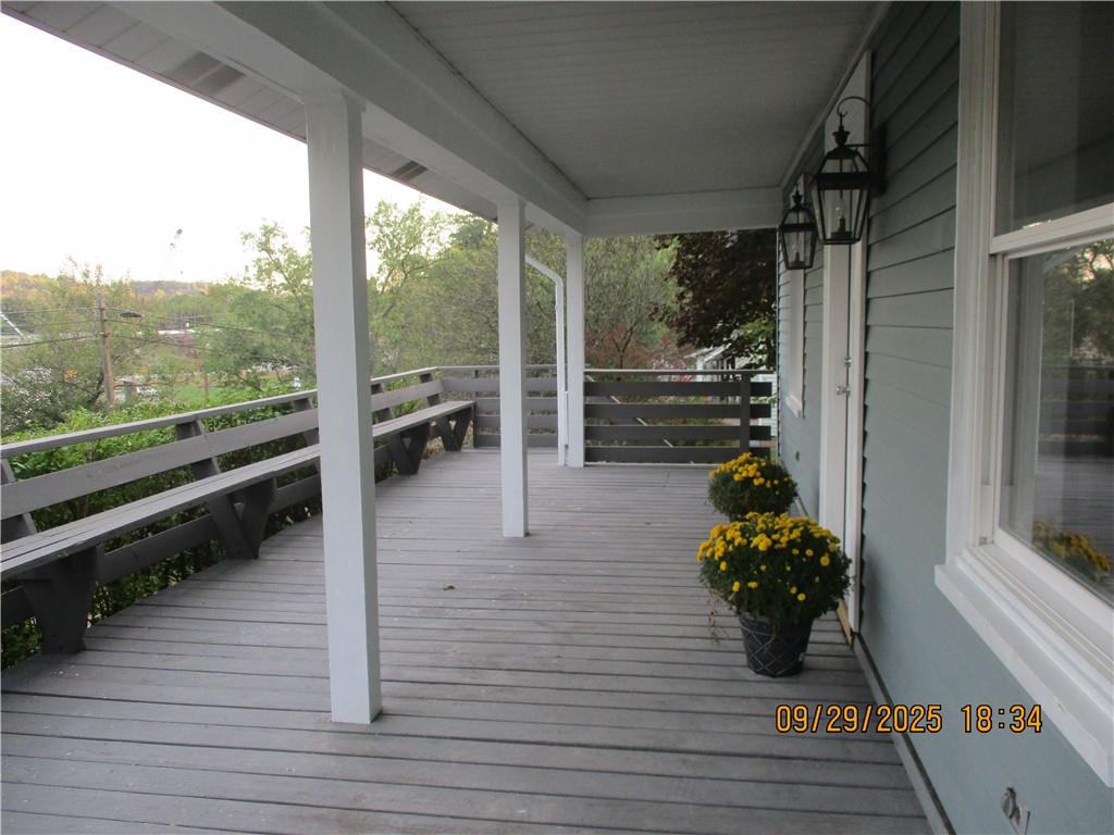 1248 East Brady Street Butler, PA 16001 - Photo 2 of 15 a view of a porch with furniture and wooden floor