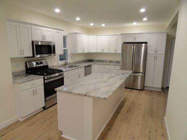 1248 East Brady Street Butler, PA 16001 - Photo 4 of 15 a kitchen with stainless steel appliances granite countertop a refrigerator a stove and a sink
