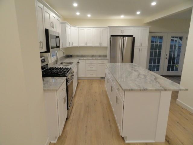 1248 East Brady Street Butler, PA 16001 - Photo 5 of 15 a kitchen with stainless steel appliances granite countertop a refrigerator a stove and a sink