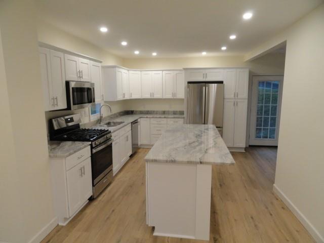 1248 East Brady Street Butler, PA 16001 - Photo 6 of 15 a kitchen with a sink stove and refrigerator