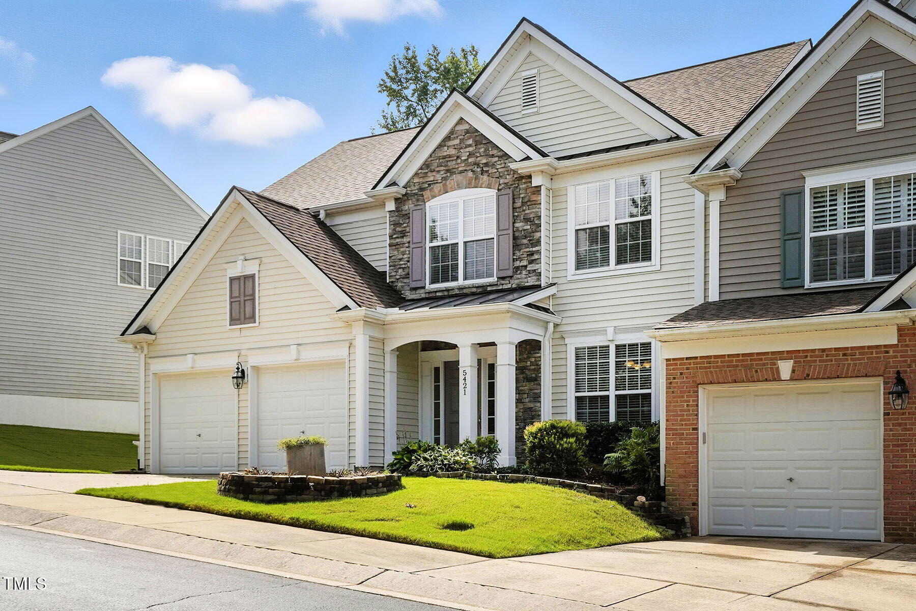 5421 Brandy Bay Road Raleigh, NC 27613 - Photo 1 of 25 a front view of a house with a yard and garage