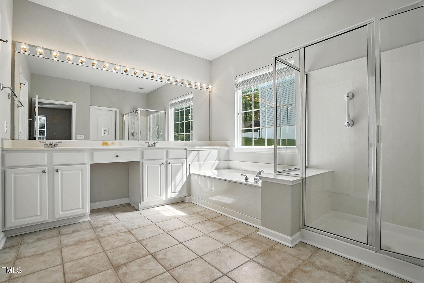 5421 Brandy Bay Road Raleigh, NC 27613 - Photo 17 of 25 a bathroom with a sink vanity and mirror