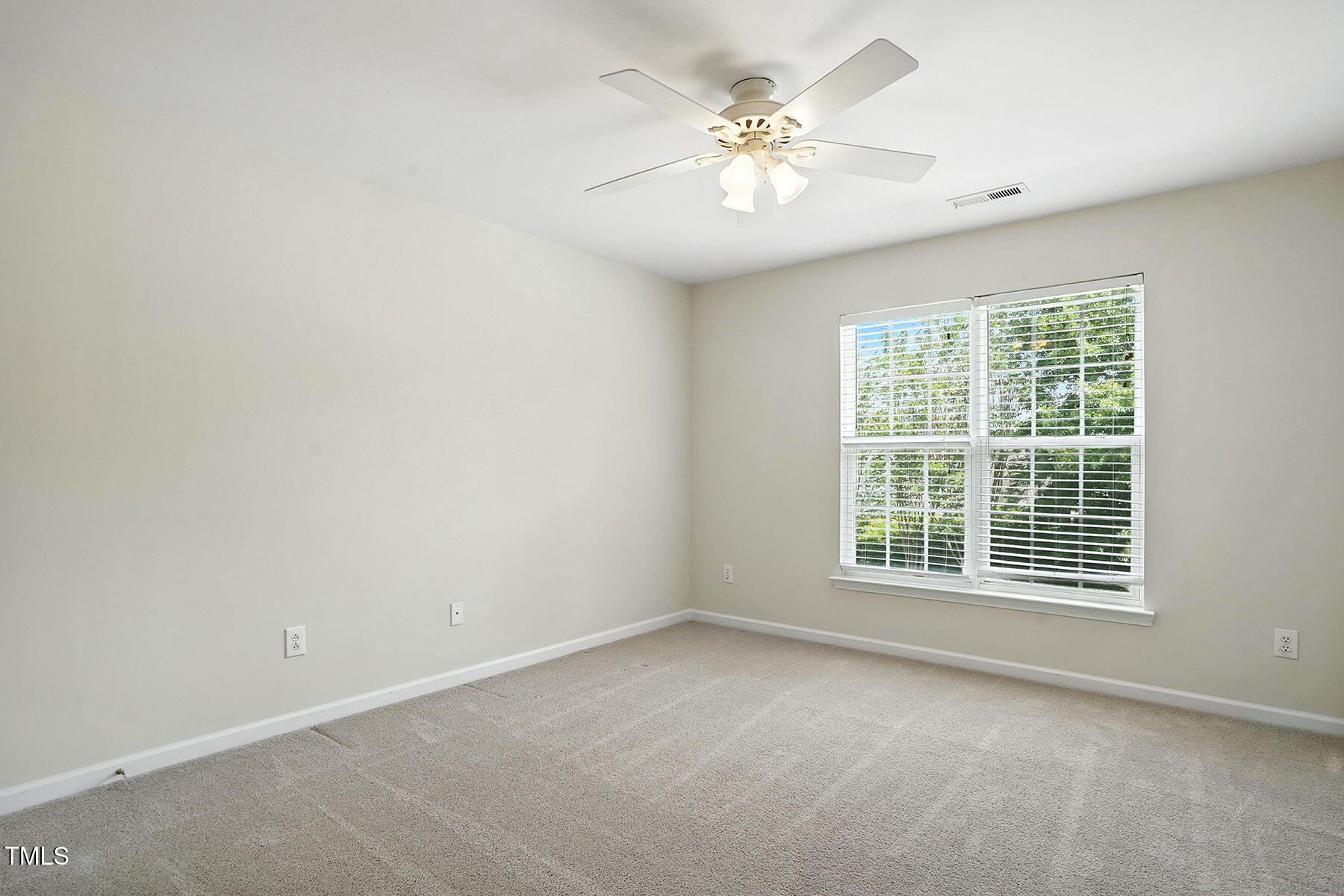 5421 Brandy Bay Road Raleigh, NC 27613 - Photo 19 of 25 an empty room with a window