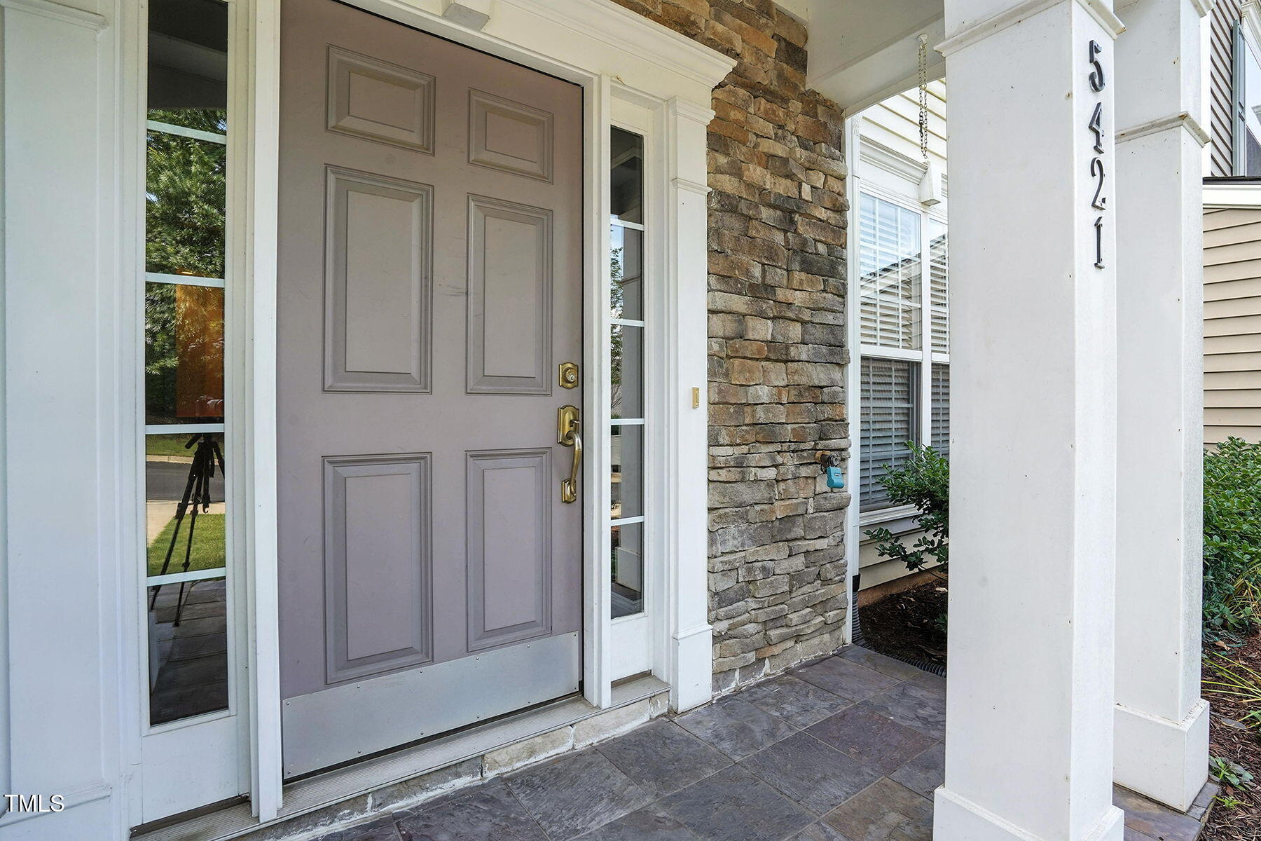 5421 Brandy Bay Road Raleigh, NC 27613 - Photo 4 of 25 a view of a wooden door and a window of the house
