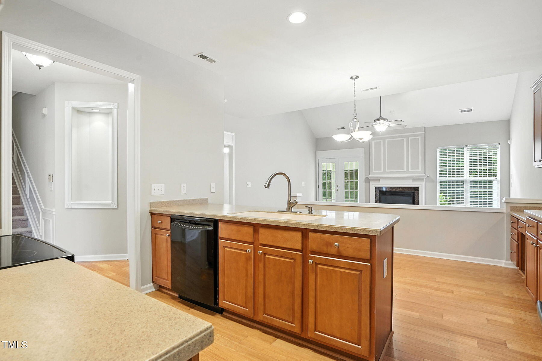 5421 Brandy Bay Road Raleigh, NC 27613 - Photo 9 of 25 a large kitchen with kitchen island a sink stainless steel appliances and cabinets