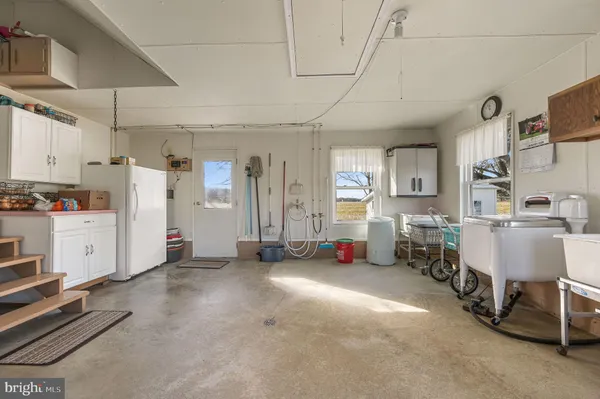 a view of a livingroom with furniture and windows