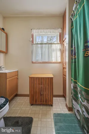 a bed room with a bed and a dresser