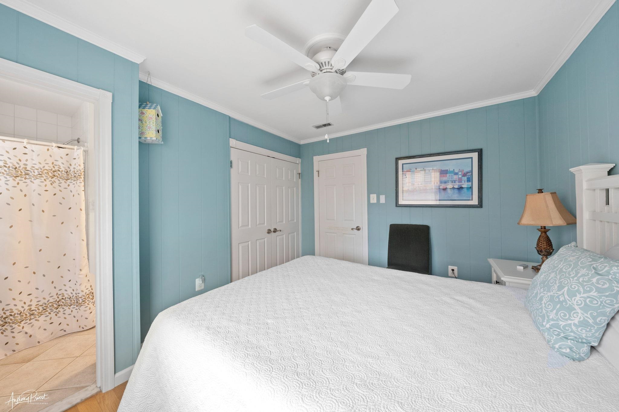 2968 First Avenue Avalon, NJ 08202 - Photo 12 of 23 a bedroom with a large bed and a window